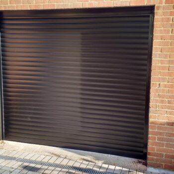 Alluguard 77 Black Rollershutter garage door with Black UPVC reveal liners